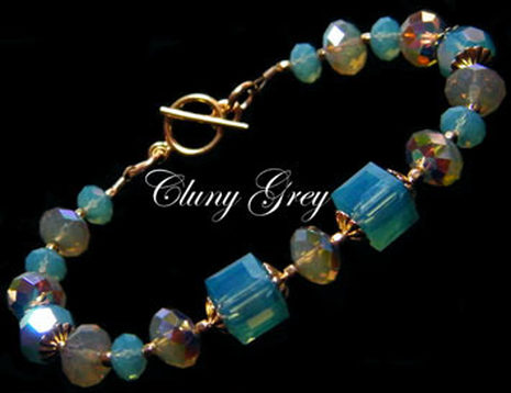 handmade Swarovski crystal bracelet with Pacific blue opal, beige opal and cubes.