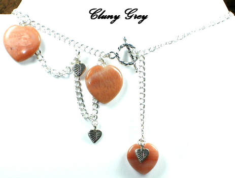 Pink agate gemstone hearts with silver chain necklace. 