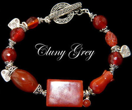 Carnelian bracelet with sterling silver and heart charms. 