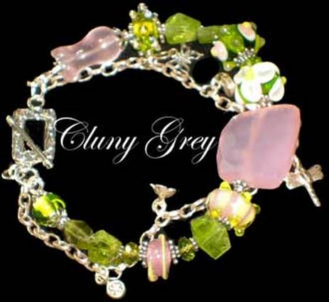 Peridot bracelet of two strands with lamp worked beads, rose quartz and charm.