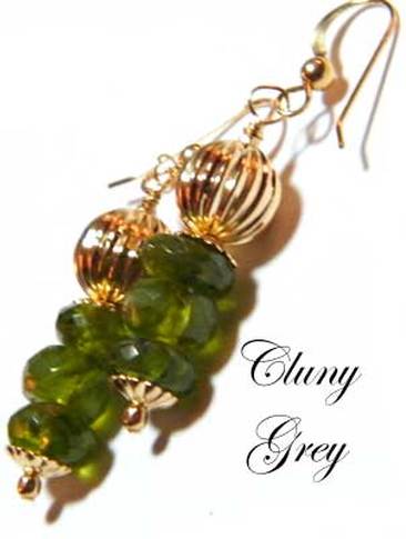 Peridot earrings with fluted gold accents and small gold beads.
