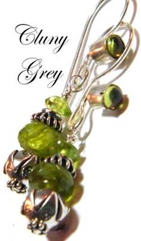 Cabochon peridots facing forward earrings with sterling silver lotus beads.