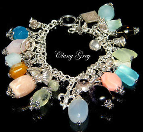 Charm bracelet with gems and sterling silver.